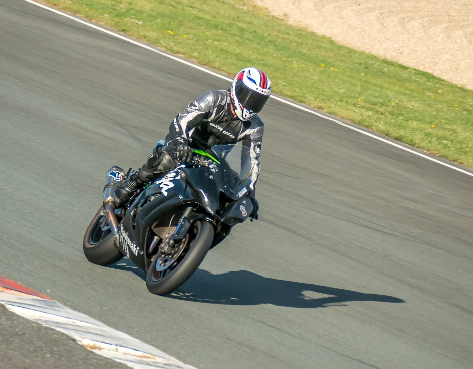 Helmeted rider wearing protective clothing on a sport motorcycle