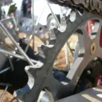Close-up of a motorcycle chain and rear sprocket