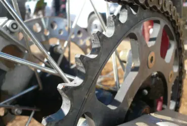 Close-up of a motorcycle chain and rear sprocket