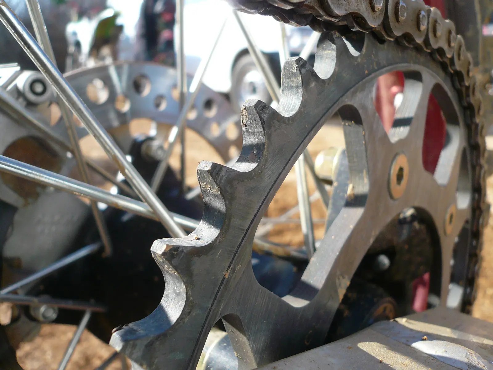 Close-up of a motorcycle chain and rear sprocket