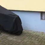 Parked motorcycle protected by a full outdoor cover