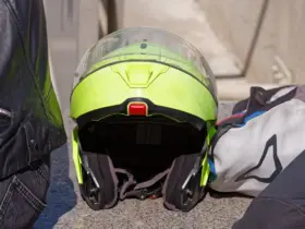 High-visibility motorcycle helmet beside riding clothing