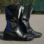 Pair of black and blue motorcycle touring boots