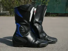 Pair of black and blue motorcycle touring boots