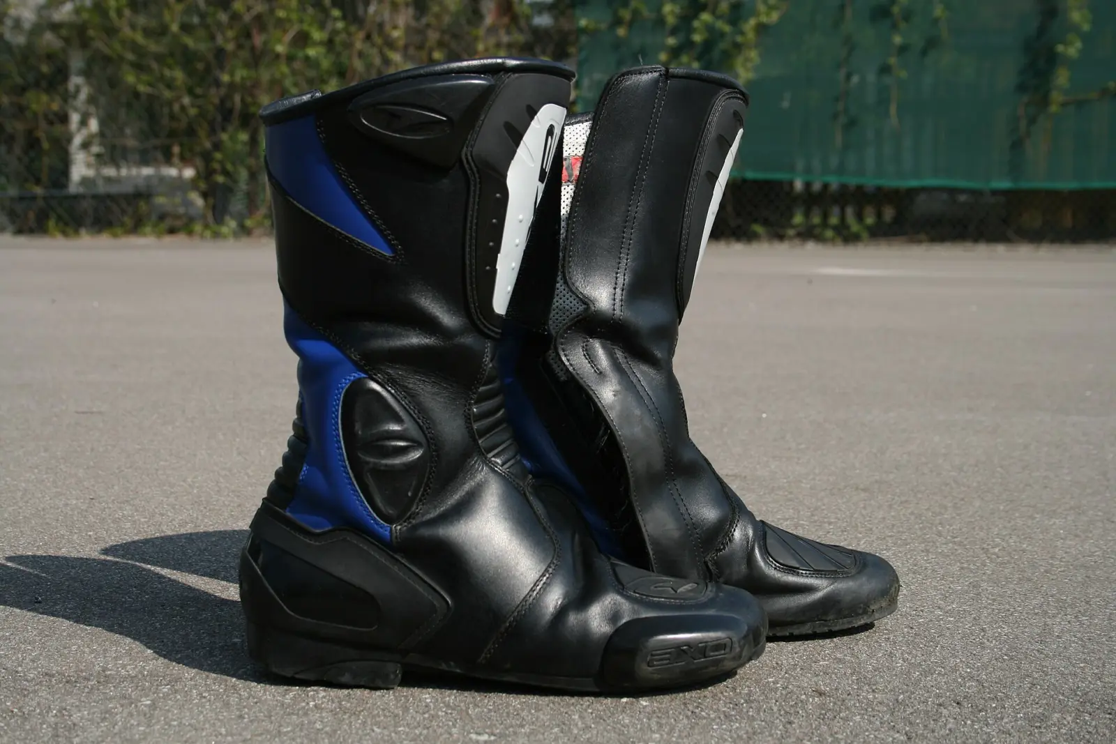 Pair of black and blue motorcycle touring boots