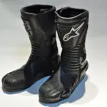 Pair of black Alpinestars S-MX motorcycle boots