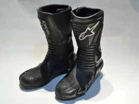 Pair of black Alpinestars S-MX motorcycle boots