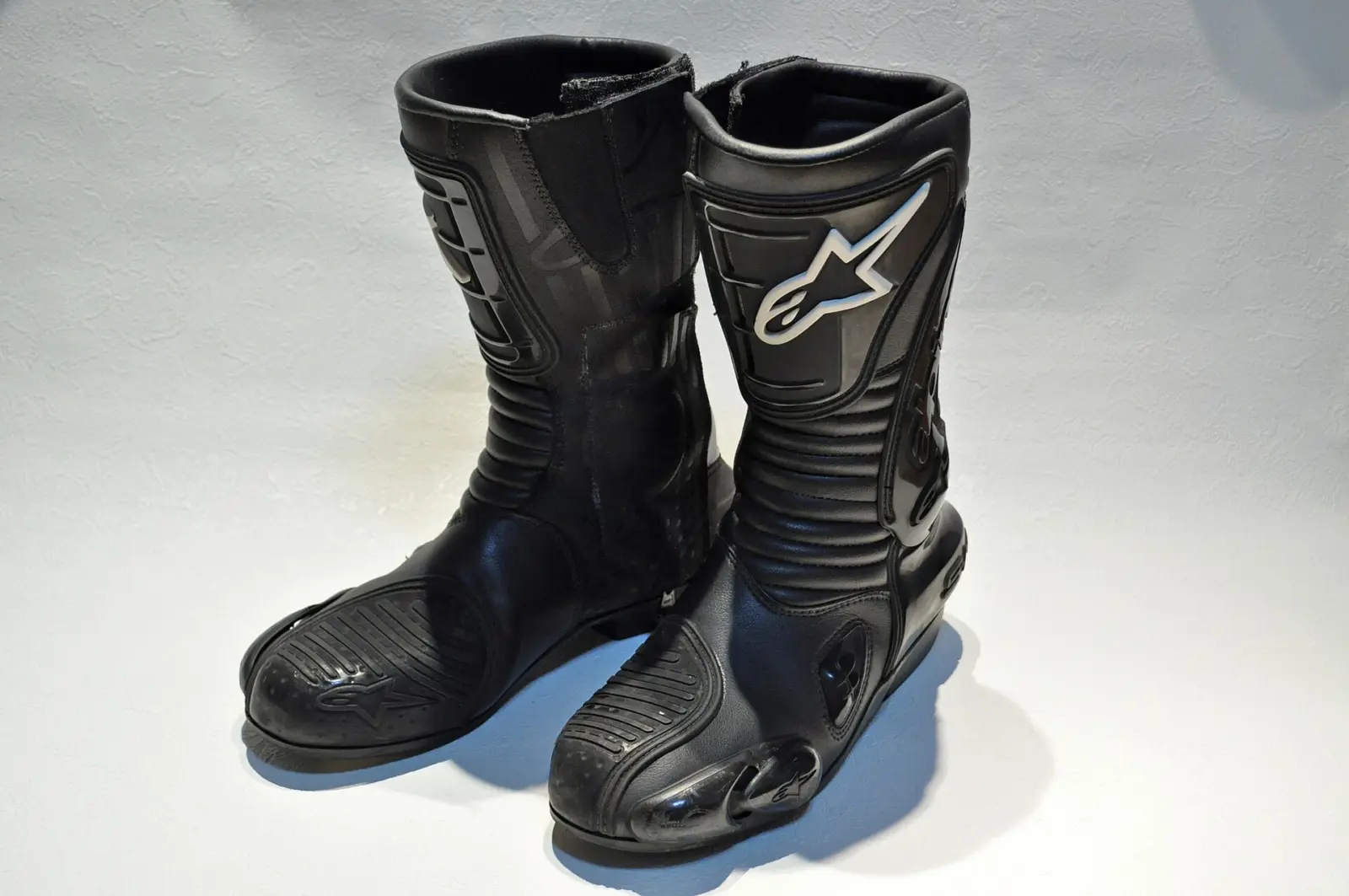 Pair of black Alpinestars S-MX motorcycle boots