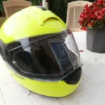 High-visibility full-face motorcycle helmet with its visor closed