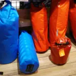 Waterproof roll-top dry bags displayed together
