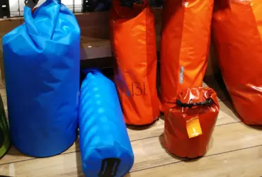 Waterproof roll-top dry bags displayed together