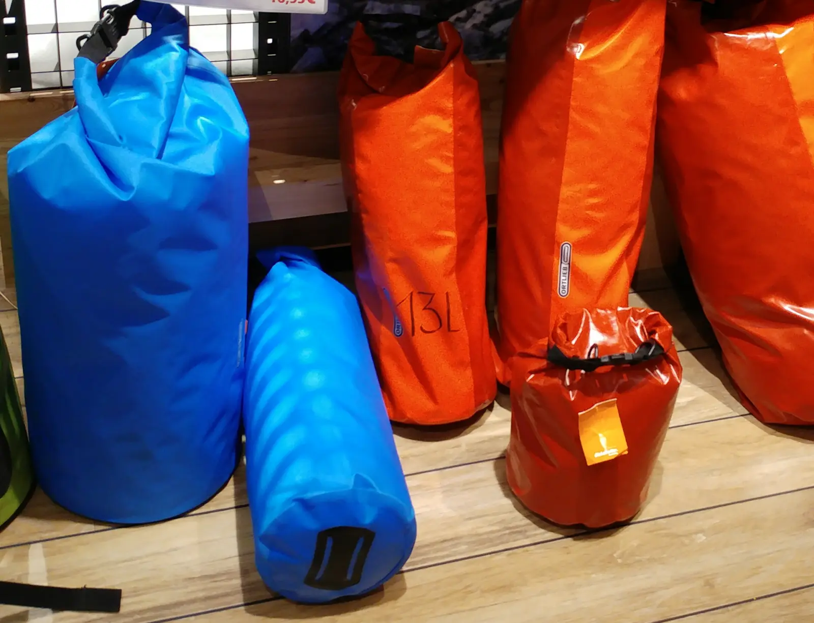 Waterproof roll-top dry bags displayed together