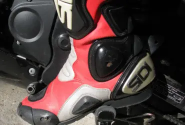 Close-up of a red and black motorcycle racing boot