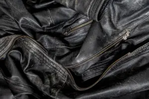 Close-up of the zips and texture of a black leather jacket