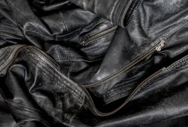 Close-up of the zips and texture of a black leather jacket
