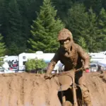 Motocross rider wearing a helmet, goggles and protective riding clothing