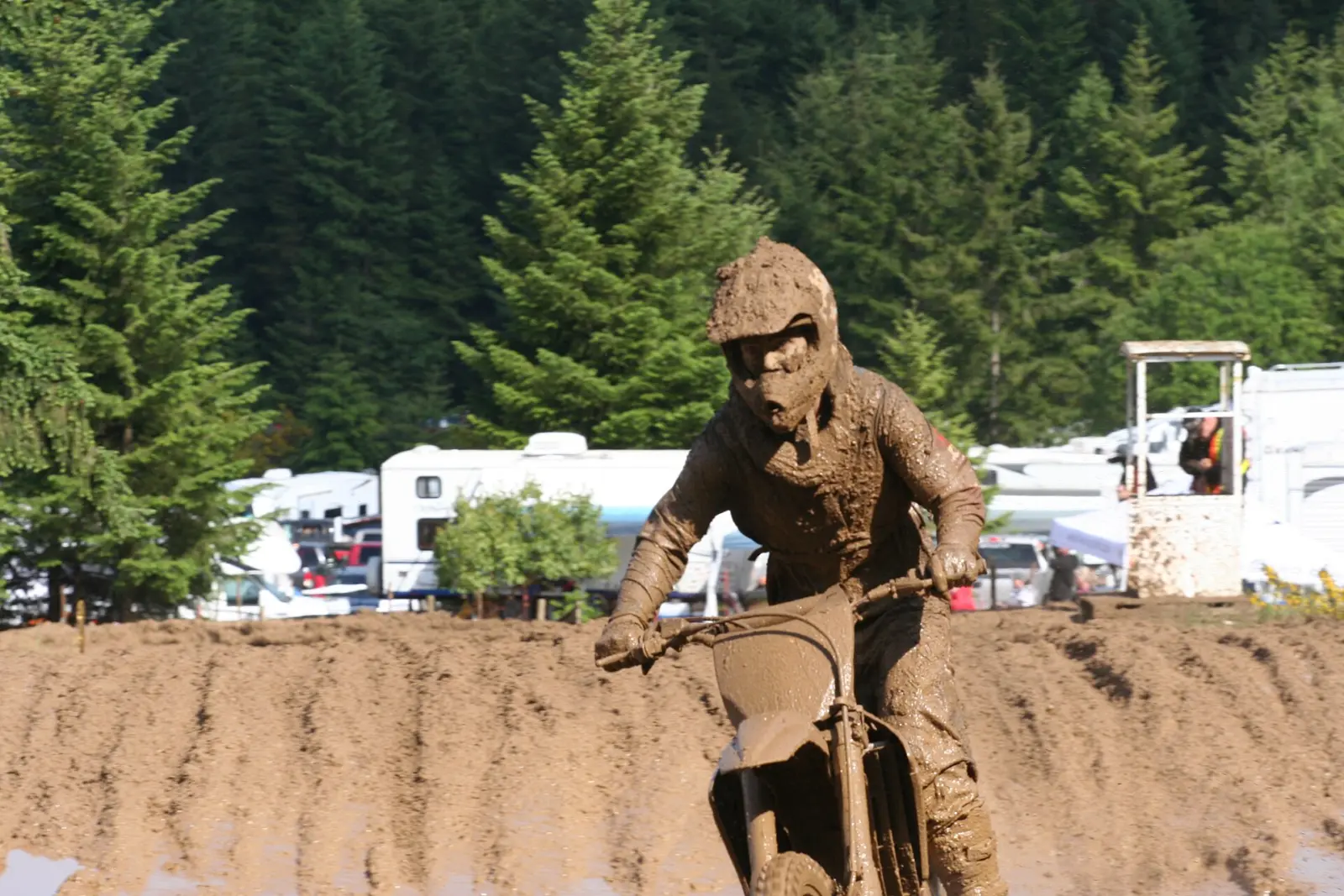 Motocross rider wearing a helmet, goggles and protective riding clothing