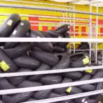 Motorcycle tyres displayed on storage racks