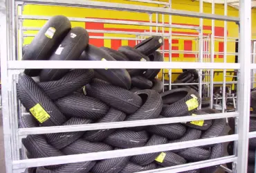 Motorcycle tyres displayed on storage racks