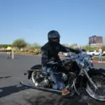 Cruiser rider wearing an open helmet and protective eyewear