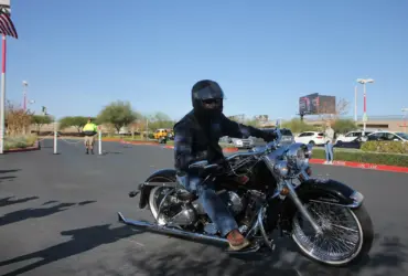 Cruiser rider wearing an open helmet and protective eyewear