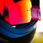 Close-up of mirrored motorcycle goggles in a helmet
