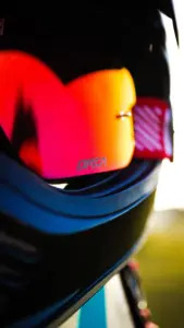 Close-up of mirrored motorcycle goggles in a helmet