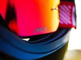 Close-up of mirrored motorcycle goggles in a helmet