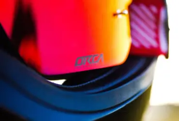 Close-up of mirrored motorcycle goggles in a helmet