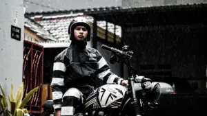 Motorcyclist wearing rain gear in rainfall