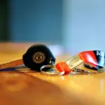 Motorcycle key with a metal keyring and fabric lanyard